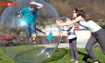 pink zorb ball with persons inside